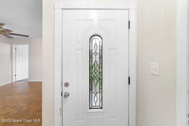 an empty space with closet and fan