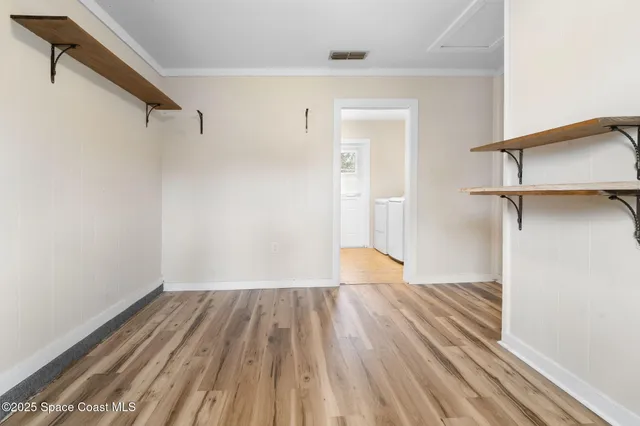 a spacious bedroom with a large bed and a large window