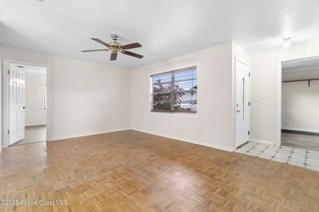 a view of an empty room with a window