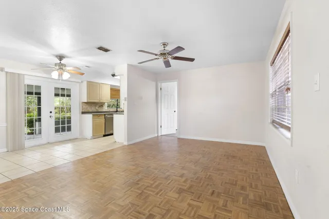 a kitchen that has a sink a stove and a window