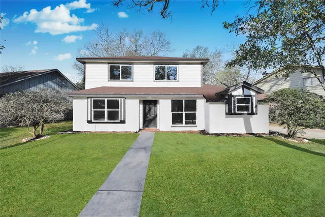 front view of a house with a yard