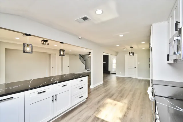 a view of a park with large trees