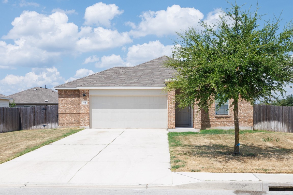 100 Copper Lane Kyle, TX 78640 - Photo 1 of 1 a front view of a house with garden