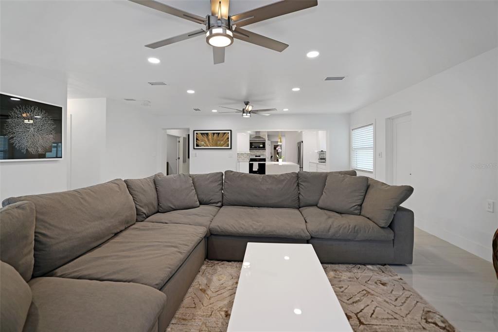 16015 Redington Drive Redington Beach, FL 33708 - Photo 20 of 60 a living room with furniture and a flat screen tv