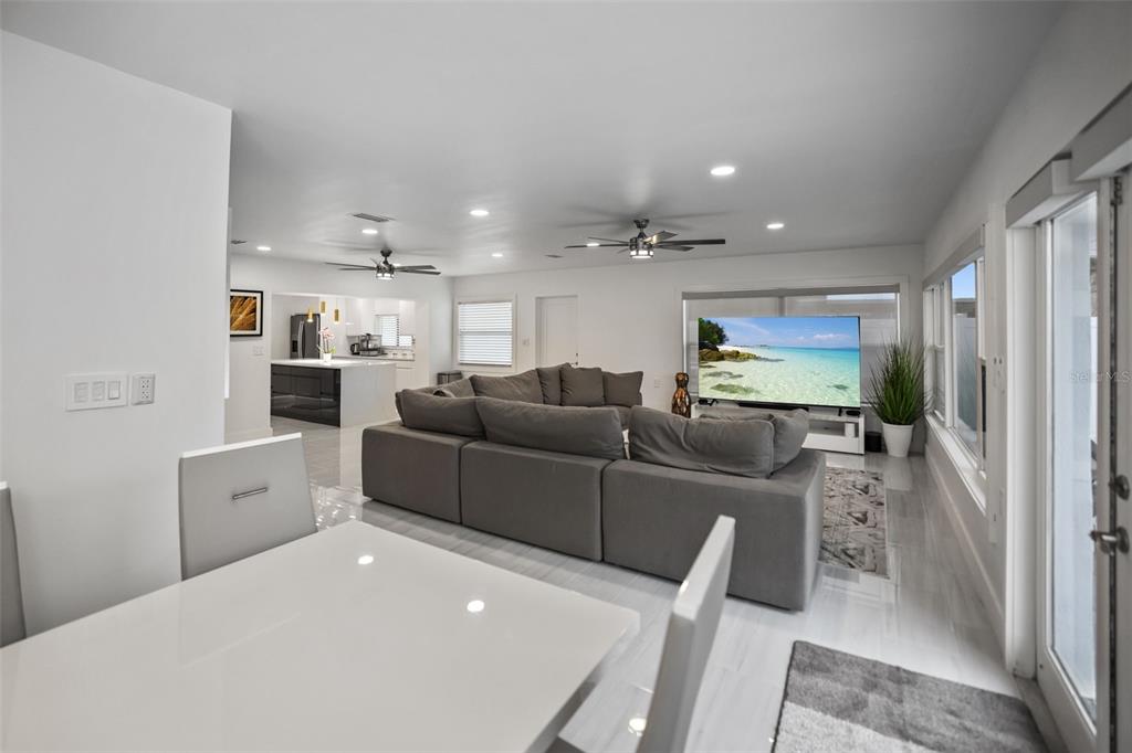 16015 Redington Drive Redington Beach, FL 33708 - Photo 22 of 60 a living room with furniture and a flat screen tv