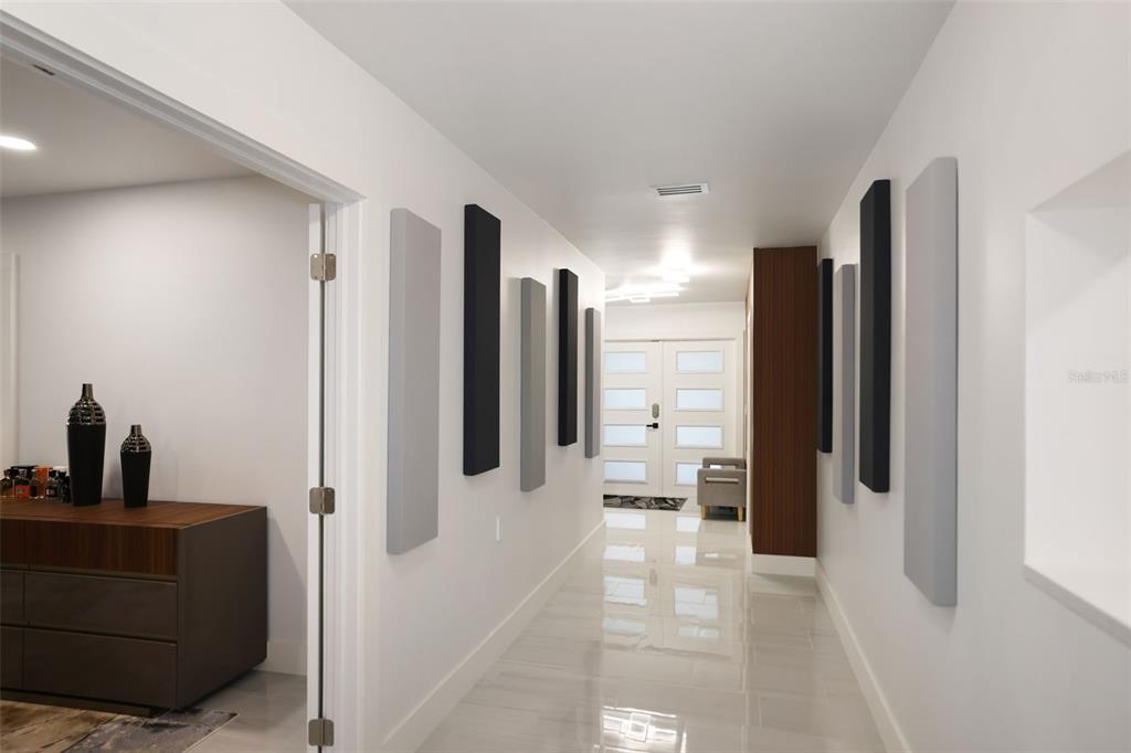 16015 Redington Drive Redington Beach, FL 33708 - Photo 25 of 60 a view of a hallway with a living room
