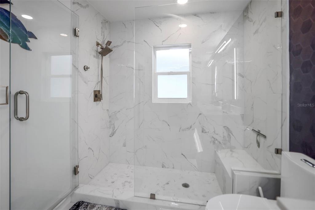 16015 Redington Drive Redington Beach, FL 33708 - Photo 32 of 60 a bathroom with a bathtub and a shower