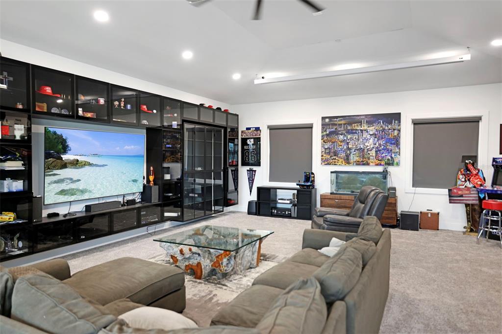 16015 Redington Drive Redington Beach, FL 33708 - Photo 42 of 60 a living room with furniture and a flat screen tv