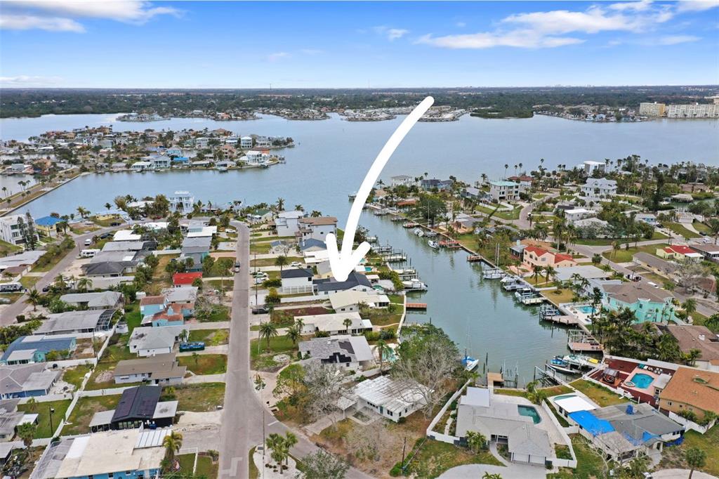 16015 Redington Drive Redington Beach, FL 33708 - Photo 57 of 60 an aerial view of a city with lots of residential buildings and ocean view in back