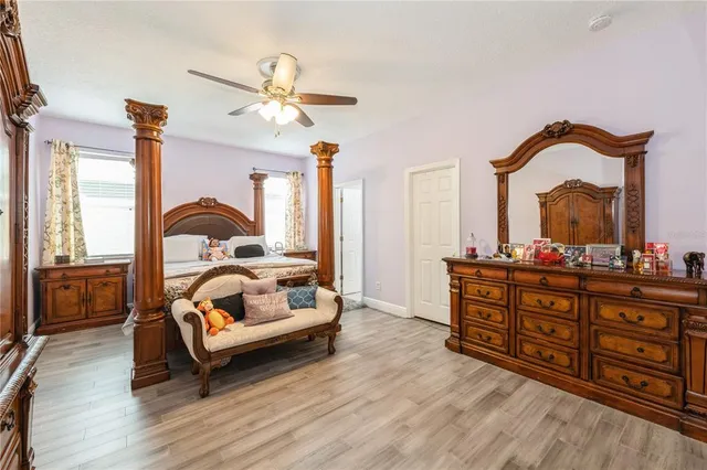 a bedroom with a bed and a dresser