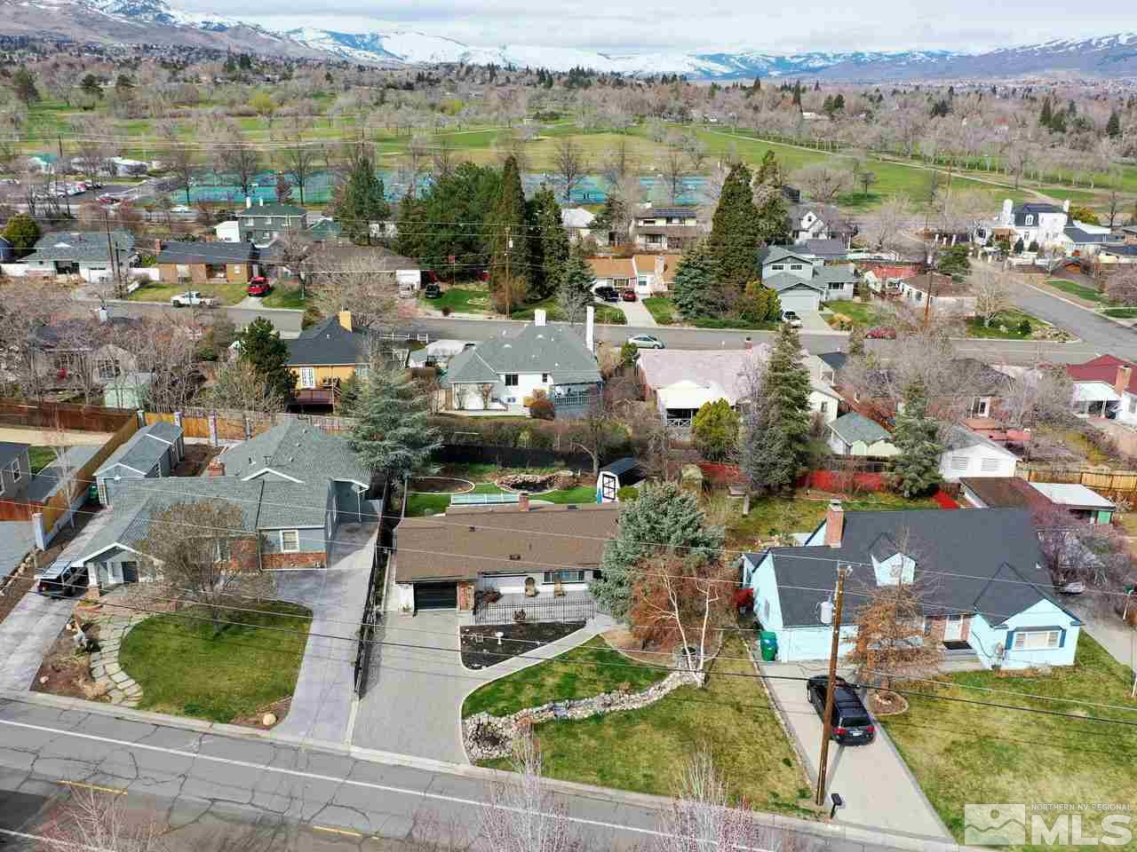 an aerial view of ocean with residential house and lake view