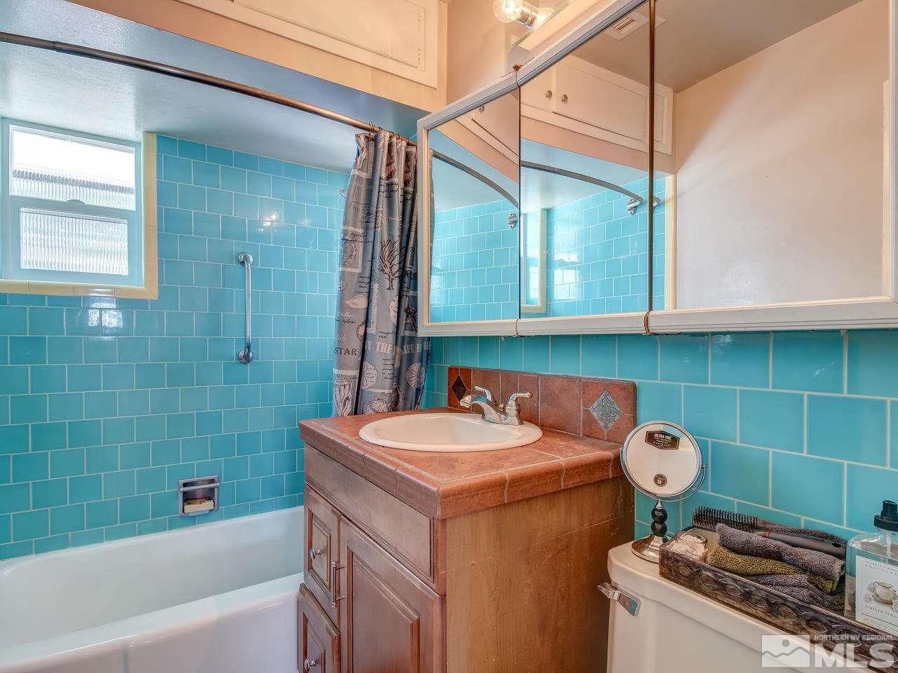2345 Watt Street Reno, NV 89509 - Photo 13 of 25 a bathroom with a sink a toilet and shower