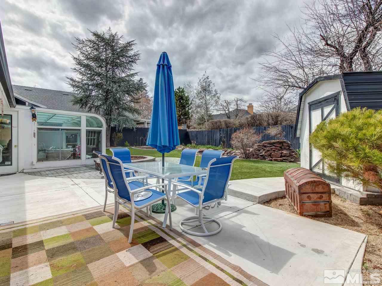 2345 Watt Street Reno, NV 89509 - Photo 18 of 25 a view of a patio with a dining table and chairs