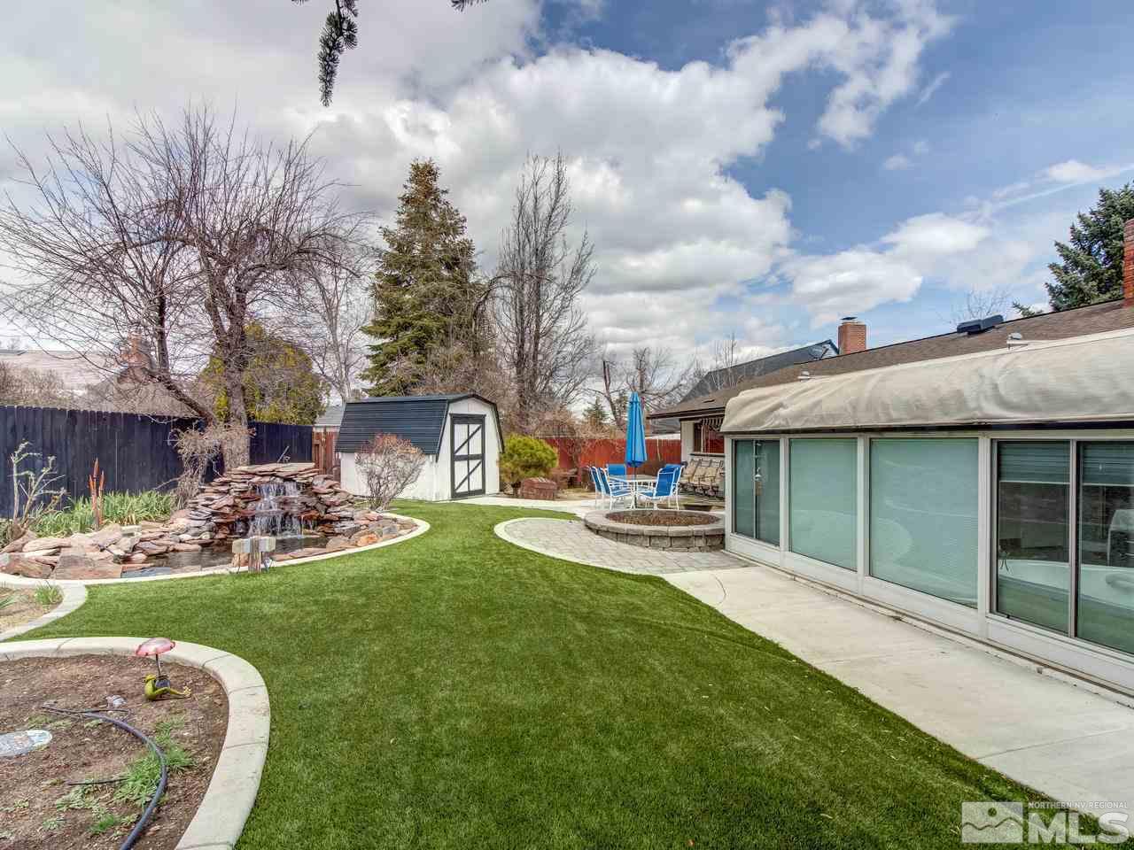 2345 Watt Street Reno, NV 89509 - Photo 19 of 25 a front view of a house with garden and sitting area
