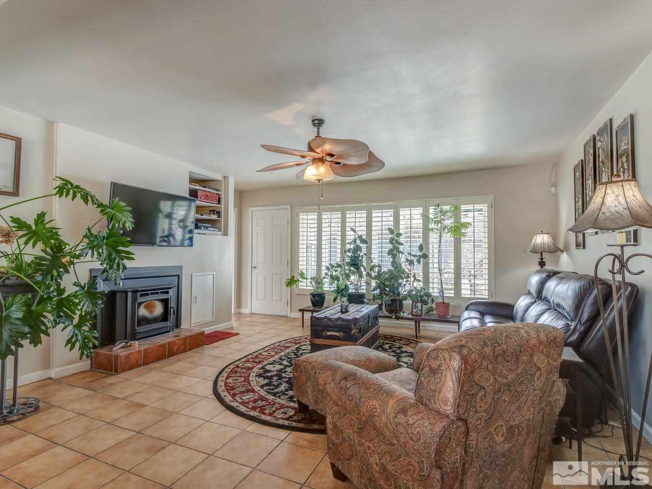 2345 Watt Street Reno, NV 89509 - Photo 3 of 25 a living room with furniture and a fireplace