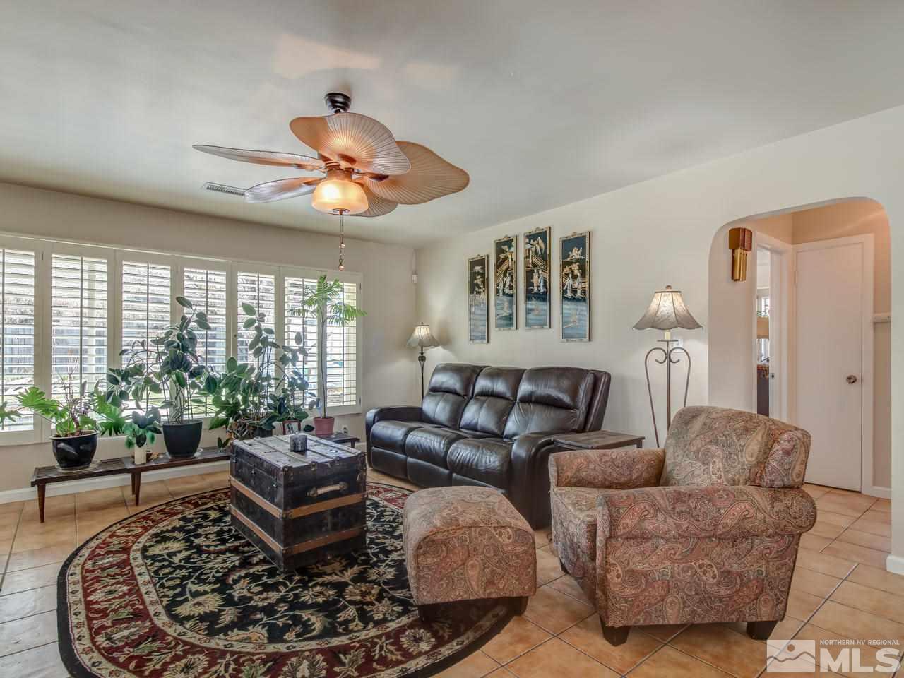2345 Watt Street Reno, NV 89509 - Photo 4 of 25 a living room with furniture potted plant and a large window