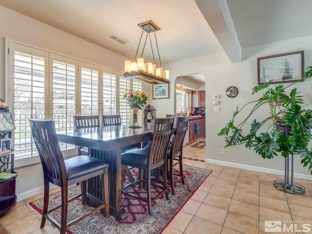 2345 Watt Street Reno, NV 89509 - Photo 7 of 25 a view of a dining room with furniture window and wooden floor
