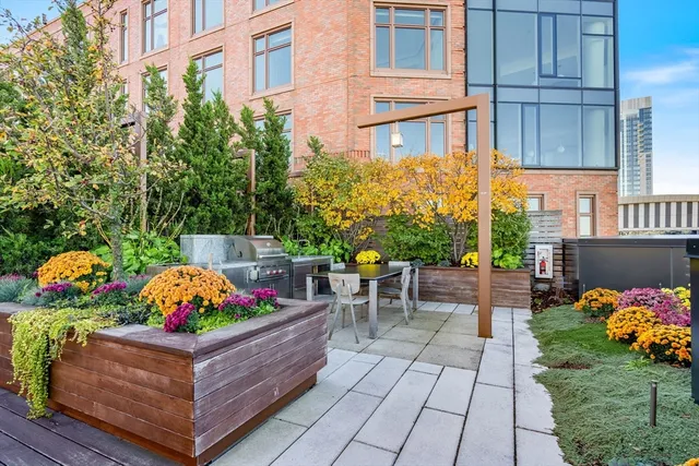 a wooden bench sitting in front of a building