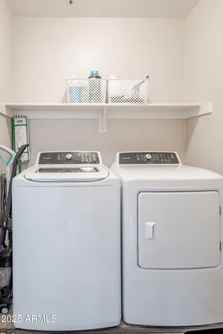 a utility room with dryer and washer