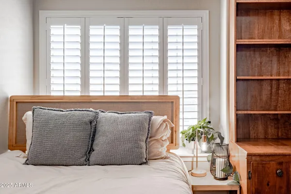 a room with a bed and a window