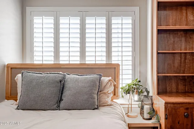 a room with a bed and a window