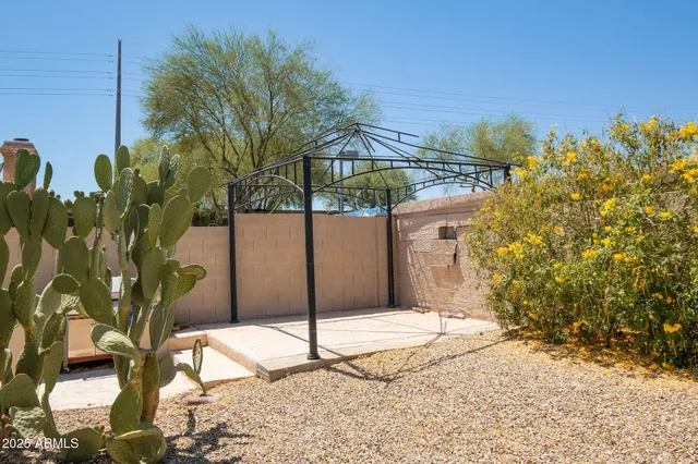 a outdoor dining space with furniture and wooden floor
