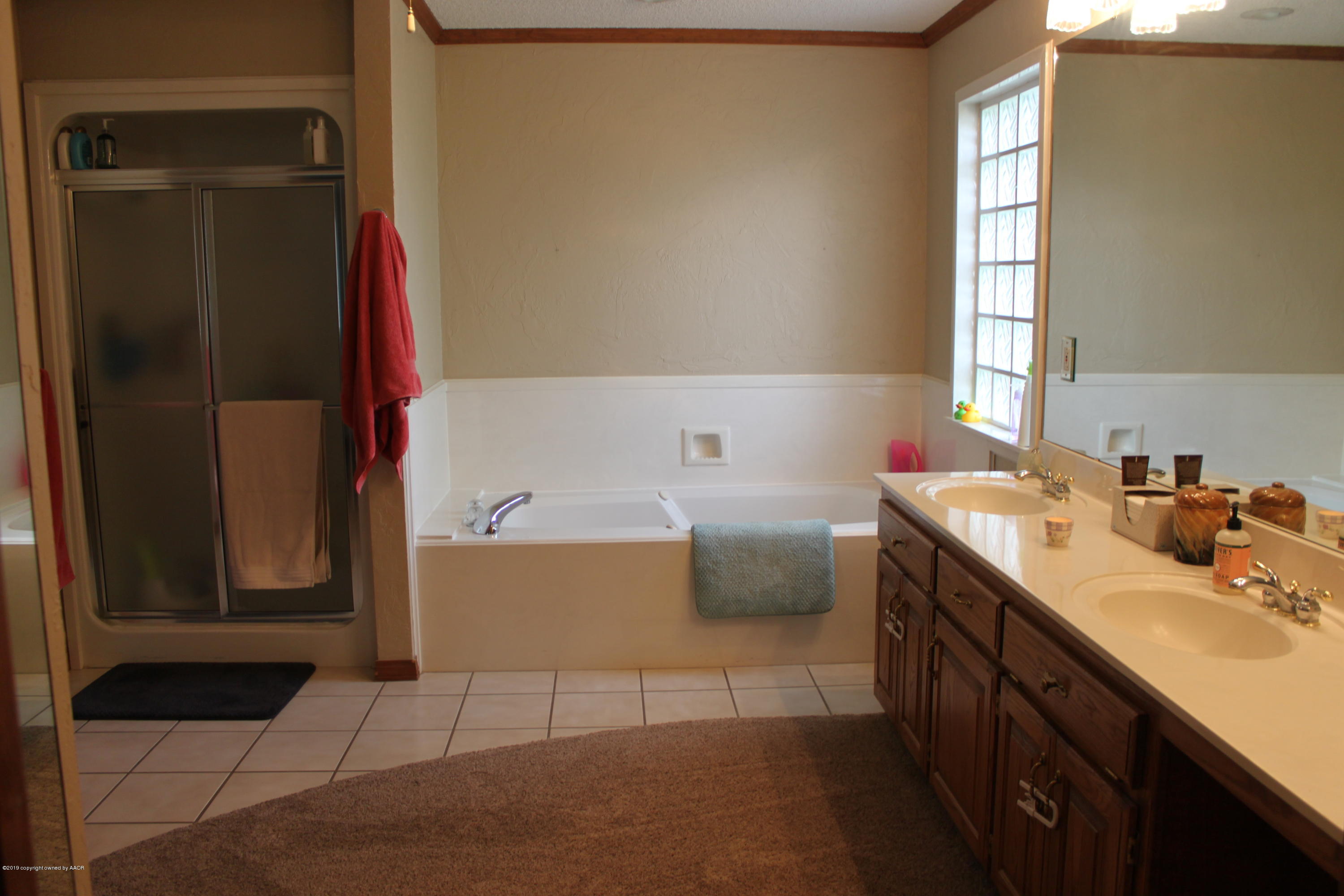 675 Sunset Road Fritch, TX 79036 - Photo 32 of 61 Master Bath_Vanity, Tub & Shower