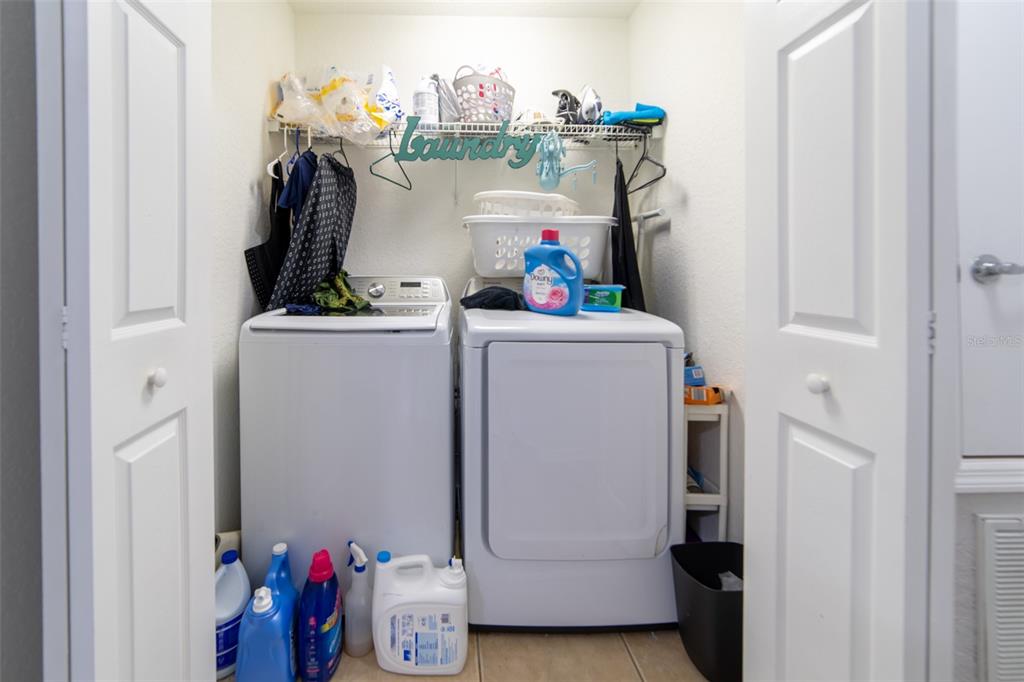 1041 Enclair Street Orlando, FL 32828 - Photo 14 of 62 a room with storage and utility