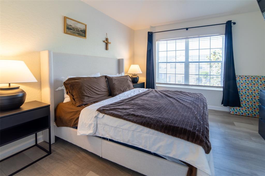 1041 Enclair Street Orlando, FL 32828 - Photo 18 of 62 a bedroom with a bed and a window
