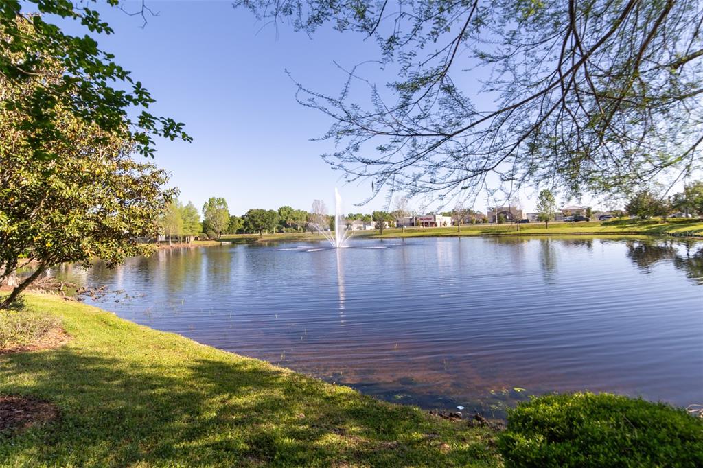 1041 Enclair Street Orlando, FL 32828 - Photo 24 of 62 a view of a lake with houses in the back