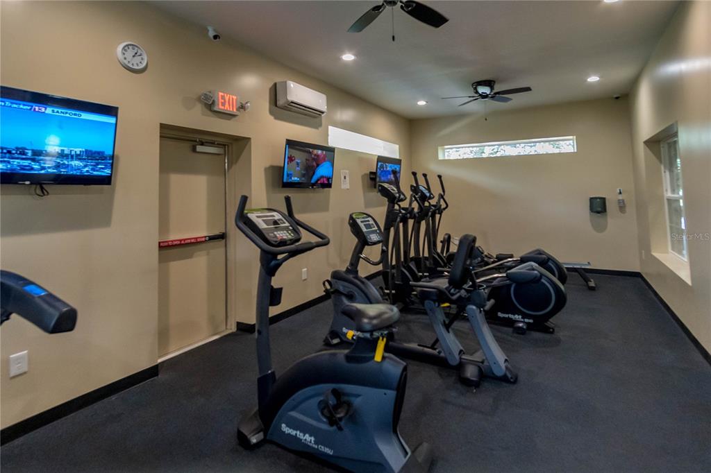 1041 Enclair Street Orlando, FL 32828 - Photo 44 of 62 a view of a room with gym equipment