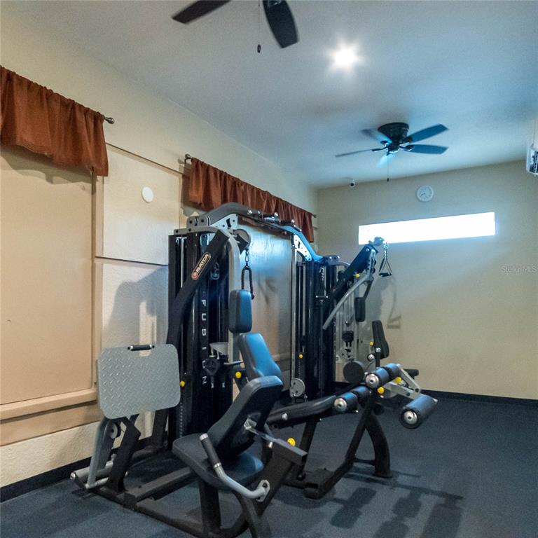 1041 Enclair Street Orlando, FL 32828 - Photo 46 of 62 a view of a room with gym equipment