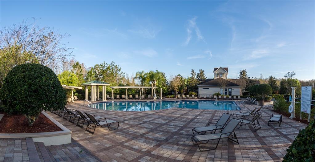 1041 Enclair Street Orlando, FL 32828 - Photo 53 of 62 a view of a chairs and table on the terrace