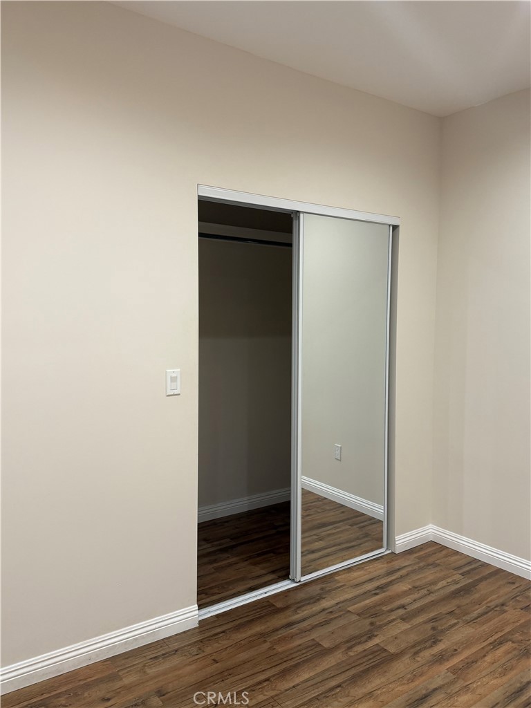 9951 Marcus Avenue, Unit 104 Tujunga, CA 91042 - Photo 15 of 16 a view of an empty room with wooden floor