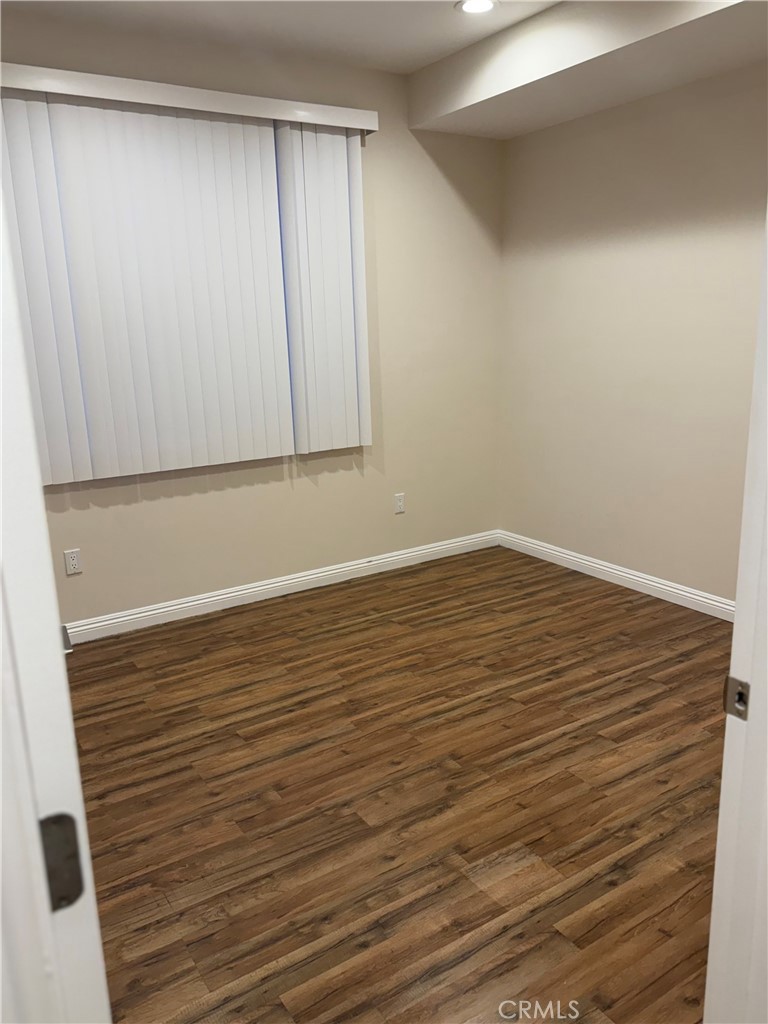 9951 Marcus Avenue, Unit 104 Tujunga, CA 91042 - Photo 5 of 16 a view of room with wooden floor