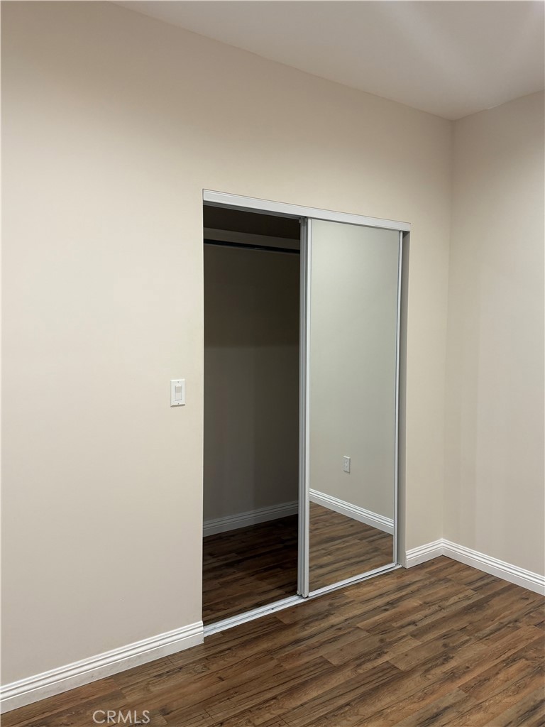 9951 Marcus Avenue, Unit 104 Tujunga, CA 91042 - Photo 6 of 16 a view of an empty room with wooden floor