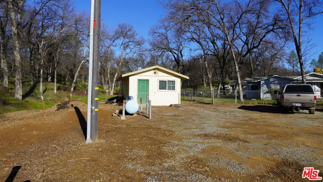 a house with trees in the background
