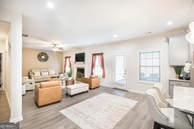 a living room with furniture and a large window