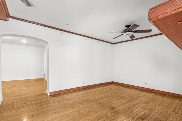 a view of a room with wooden floor