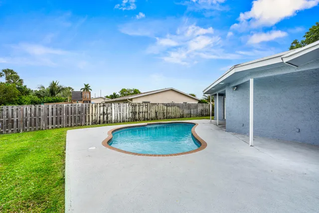a view of outdoor space yard and swimming pool