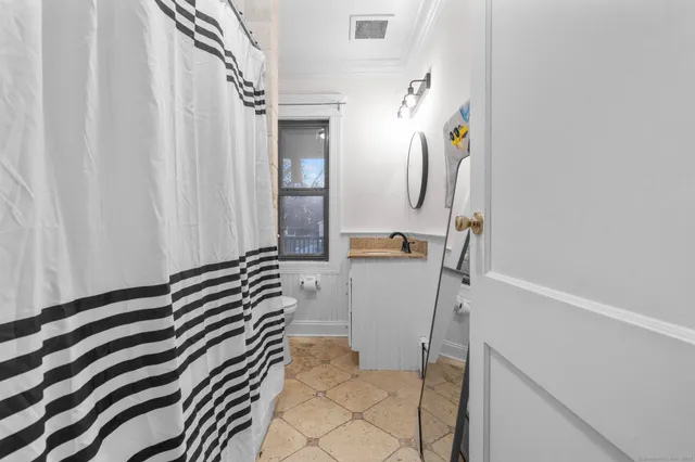 a bedroom with a bed and a cabinets