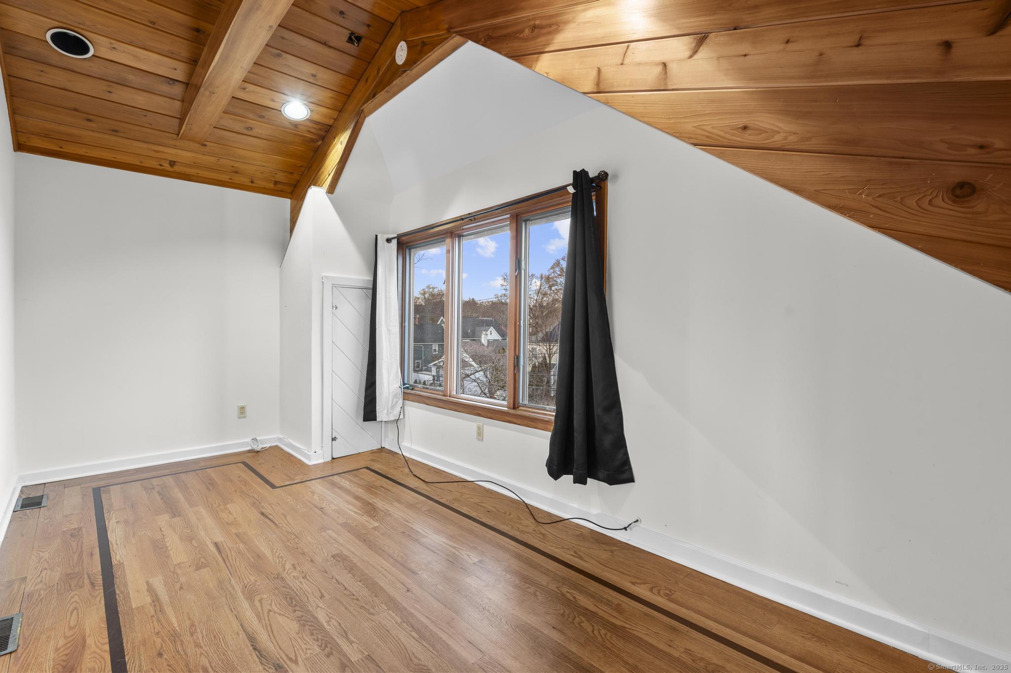 33 Douglas Avenue, Unit 2 Stamford, CT 06906 - Photo 19 of 32 a view of an empty room with a window