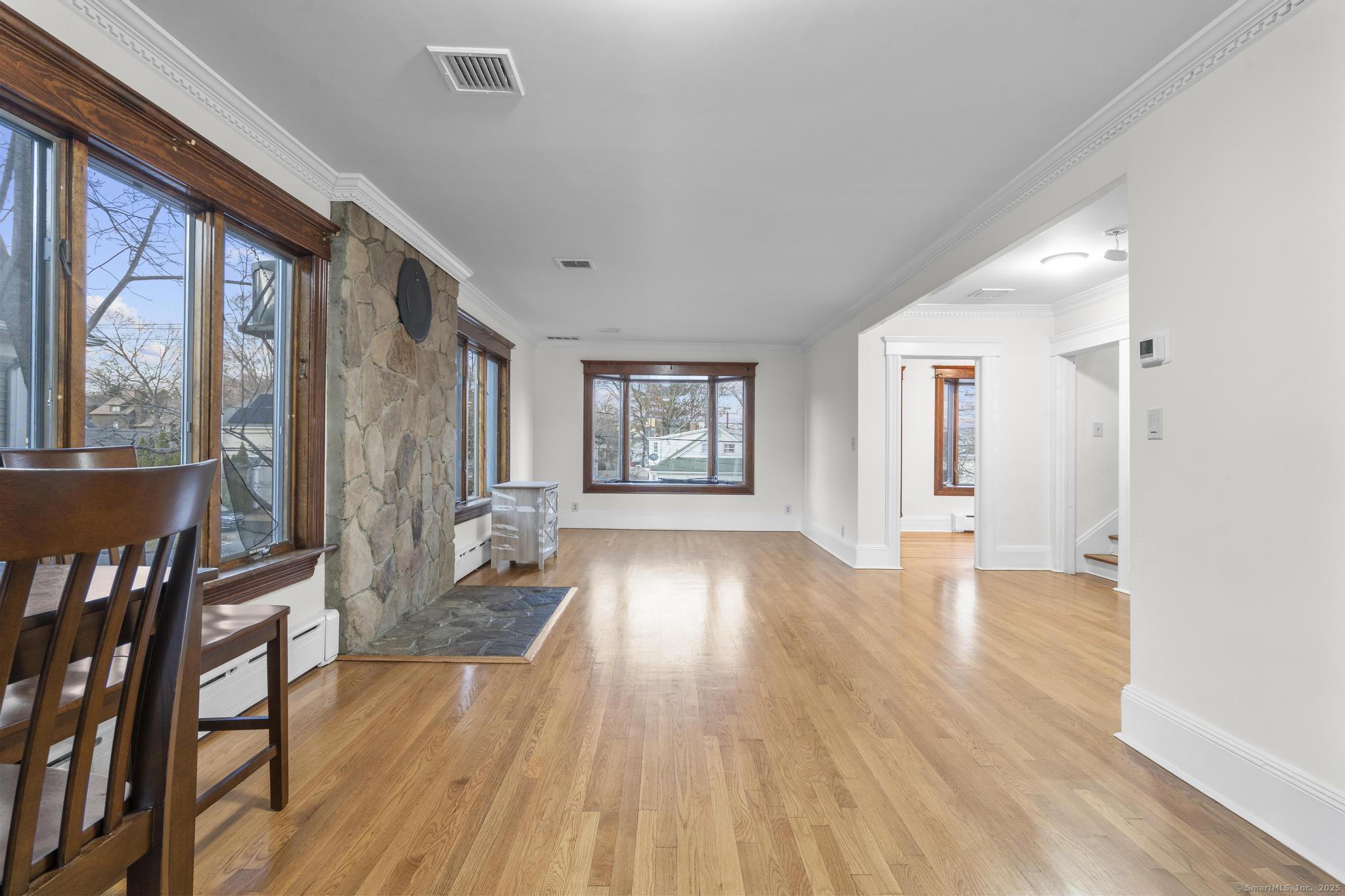 33 Douglas Avenue, Unit 2 Stamford, CT 06906 - Photo 2 of 32 a view of an entryway with wooden floor and door