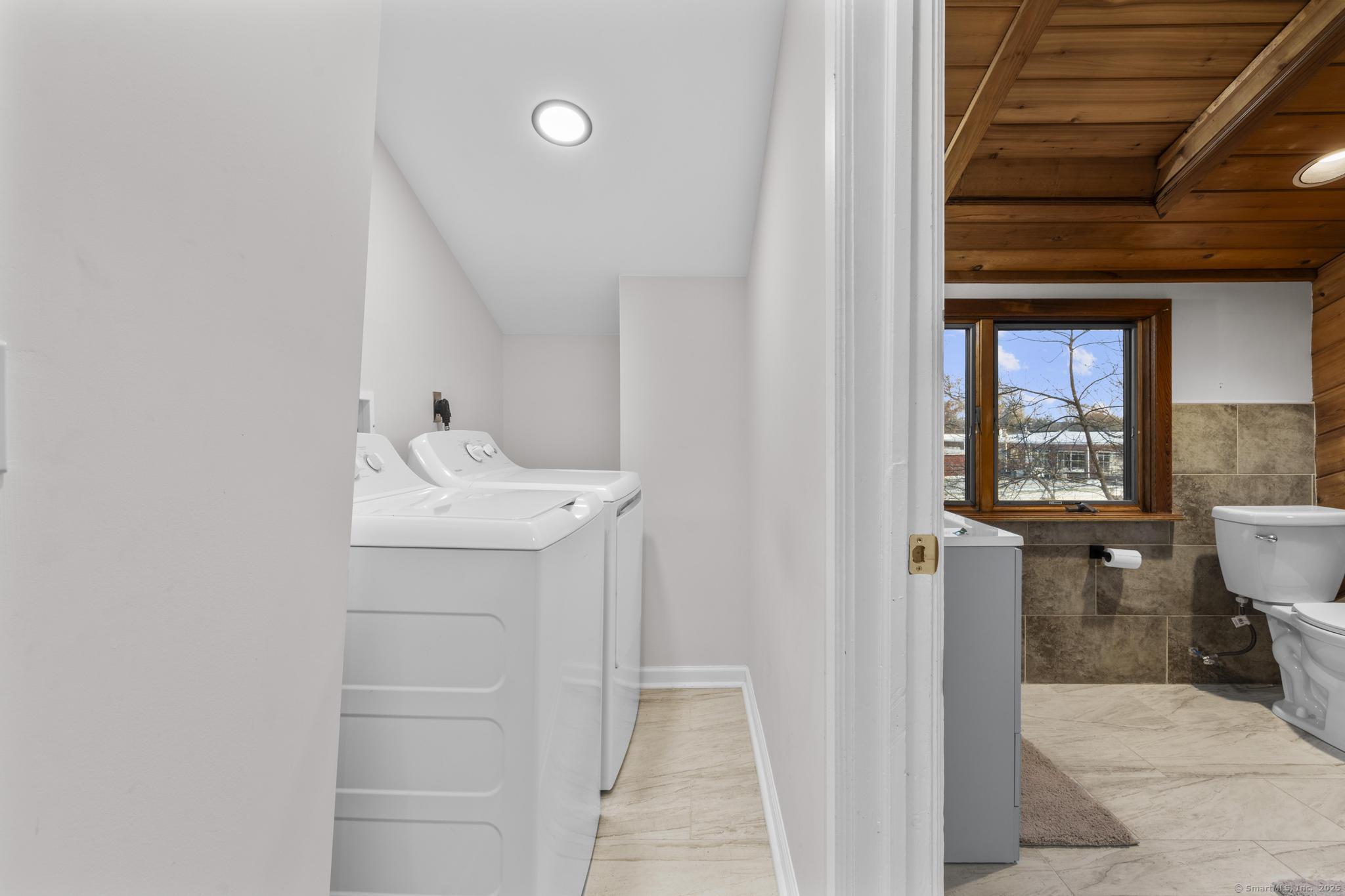 33 Douglas Avenue, Unit 2 Stamford, CT 06906 - Photo 25 of 32 a bathroom with a sink and a mirror
