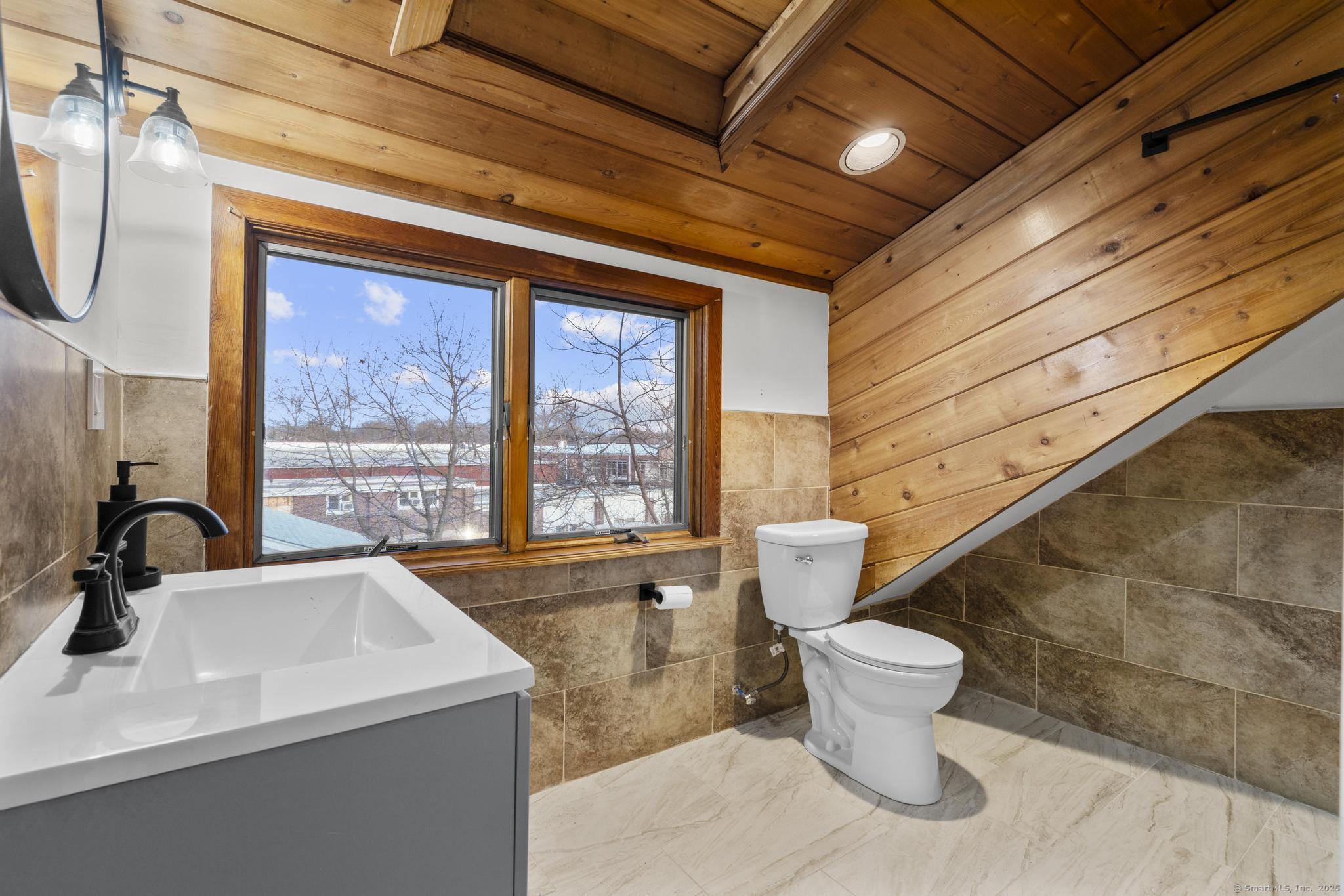 33 Douglas Avenue, Unit 2 Stamford, CT 06906 - Photo 26 of 32 a bathroom with a sink and a toilet
