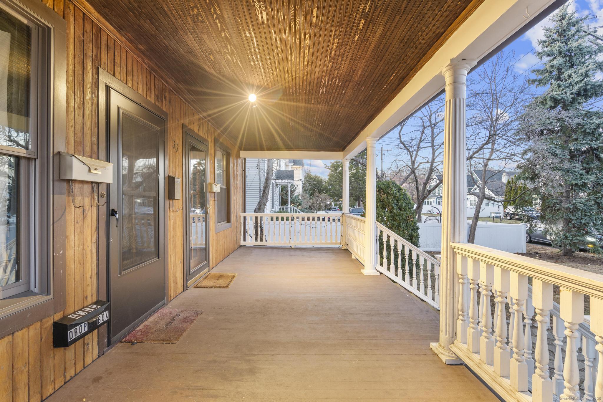 33 Douglas Avenue, Unit 2 Stamford, CT 06906 - Photo 28 of 32 a view of a porch with wooden floor and outdoor space