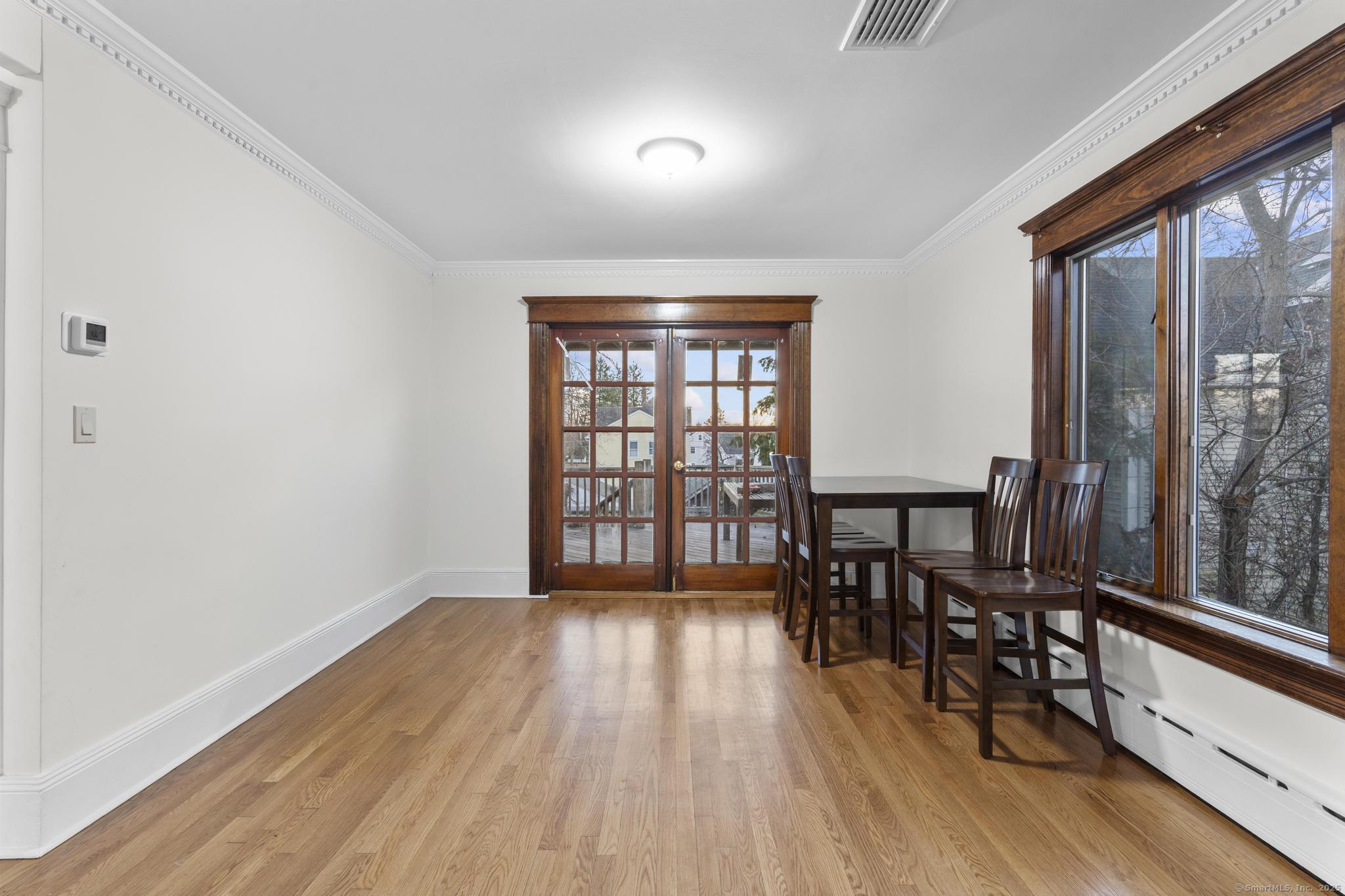 33 Douglas Avenue, Unit 2 Stamford, CT 06906 - Photo 7 of 32 wooden floor in an empty room with a window