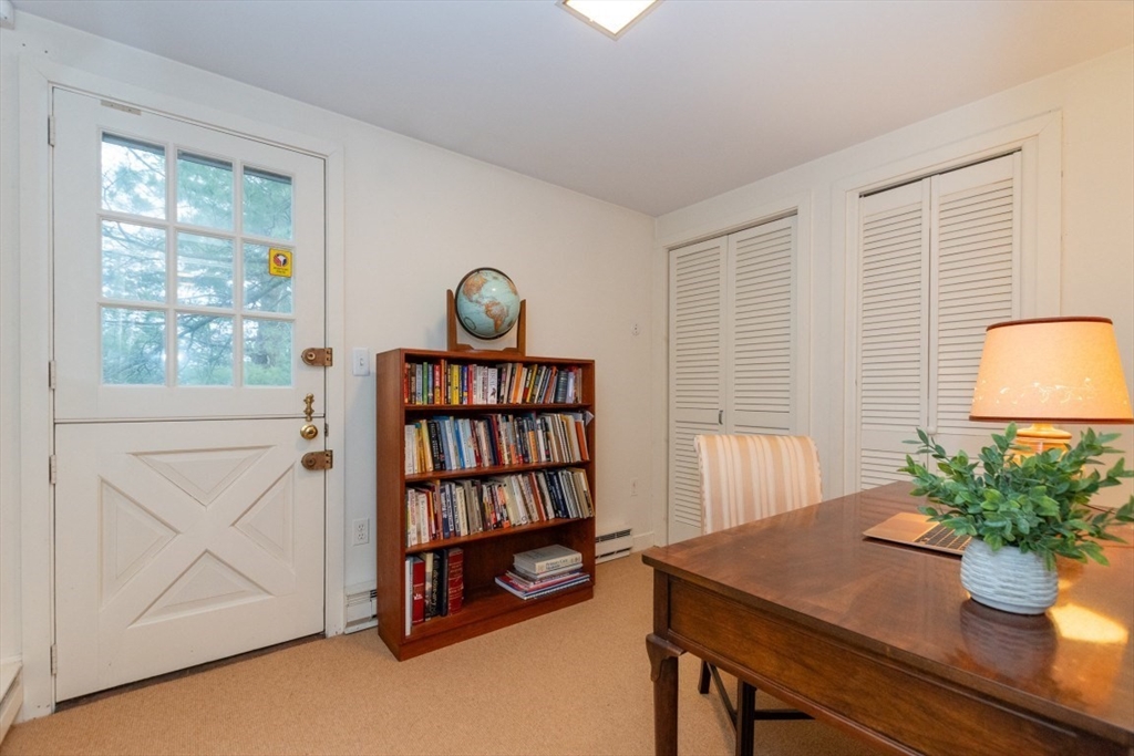 73 Valentine Street Newton, MA 02465 - Photo 11 of 26 a room with furniture and a potted plant