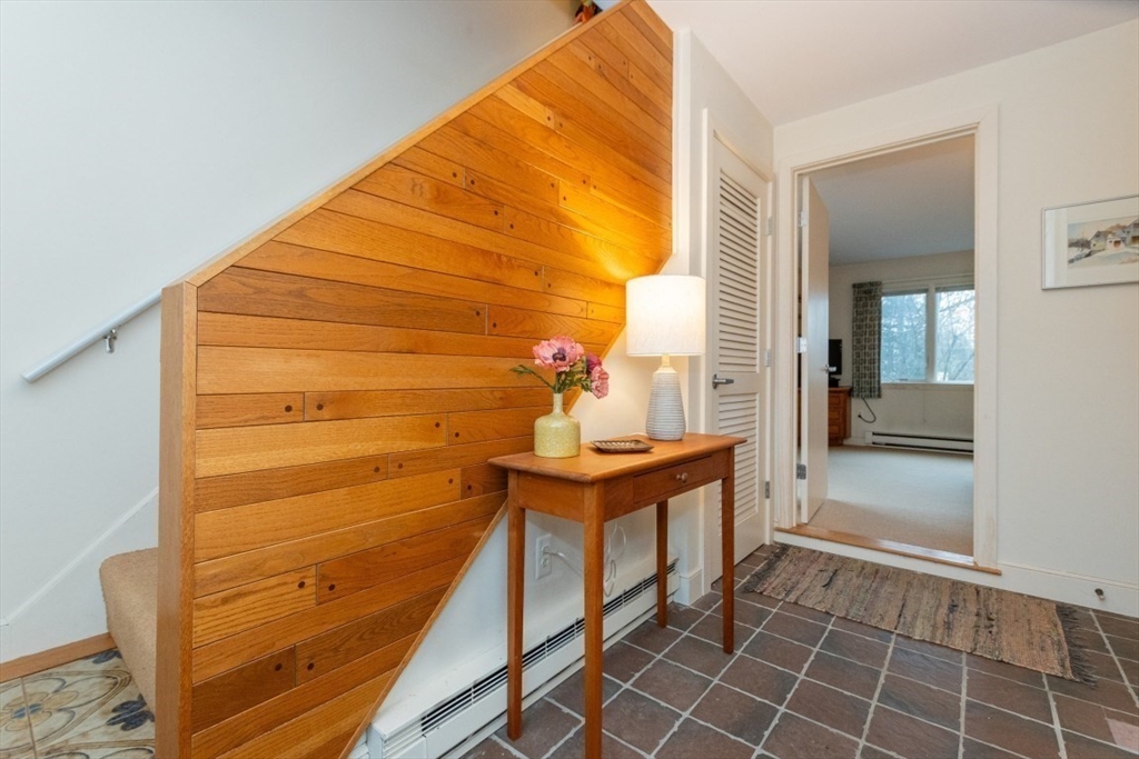 73 Valentine Street Newton, MA 02465 - Photo 14 of 26 a bathroom with a sink and mirror