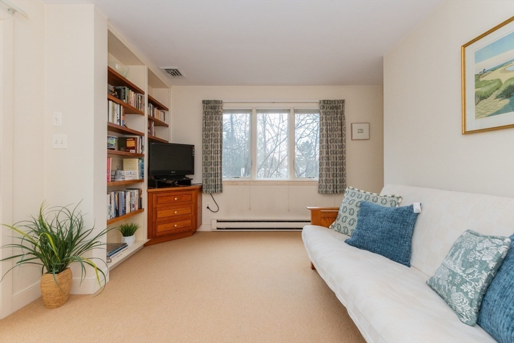 73 Valentine Street Newton, MA 02465 - Photo 15 of 26 a living room with furniture and a flat screen tv